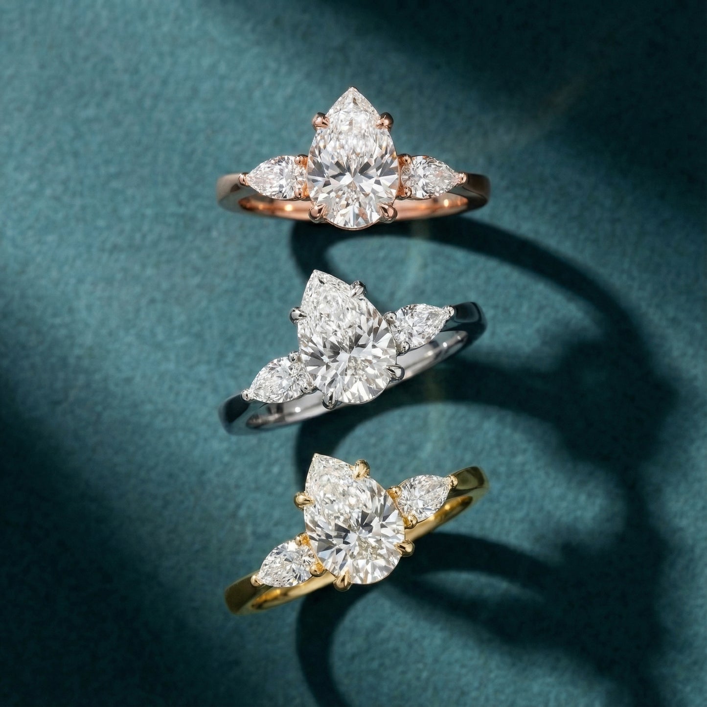 Pear Cut Lab Grown Diamond Three Stone Engagement Ring in Yellow Gold