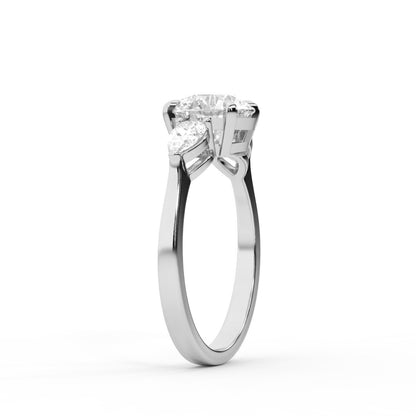 Round cut lab grown diamond three stone engagement ring in platinum setting