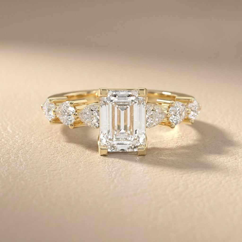 Emerald Cut Lab Grown Diamond Engagement Ring with Marquise and Pear Side Stones in Yellow Gold