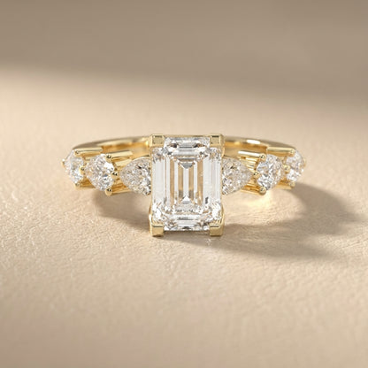 Emerald Cut Lab Grown Diamond Engagement Ring with Marquise and Pear Side Stones in Yellow Gold