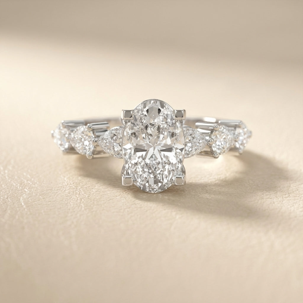 Oval Cut Lab Grown Diamond Engagement Ring with Marquise and Pear Side Stones in Platinum