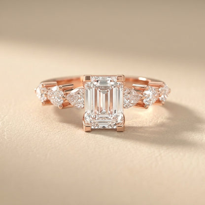 Emerald Cut Lab Grown Diamond Engagement Ring with Marquise and Pear Side Stones in Rose Gold