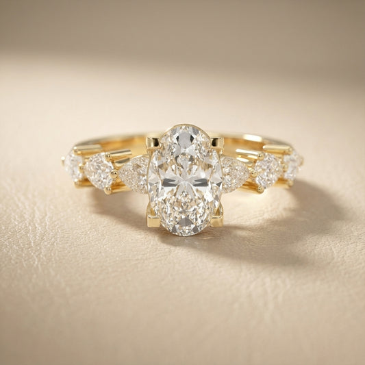 Oval Cut Lab Grown Diamond Engagement Ring with Marquise and Pear Side Stones in Yellow Gold