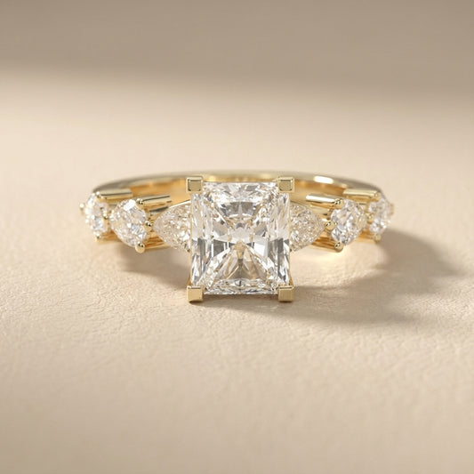 Radiant Cut Lab Grown Diamond Engagement Ring with Marquise and Pear Side Stones in Yellow Gold