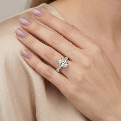 Oval Cut Lab Grown Diamond Engagement Ring with Marquise and Pear Side Stones in Platinum