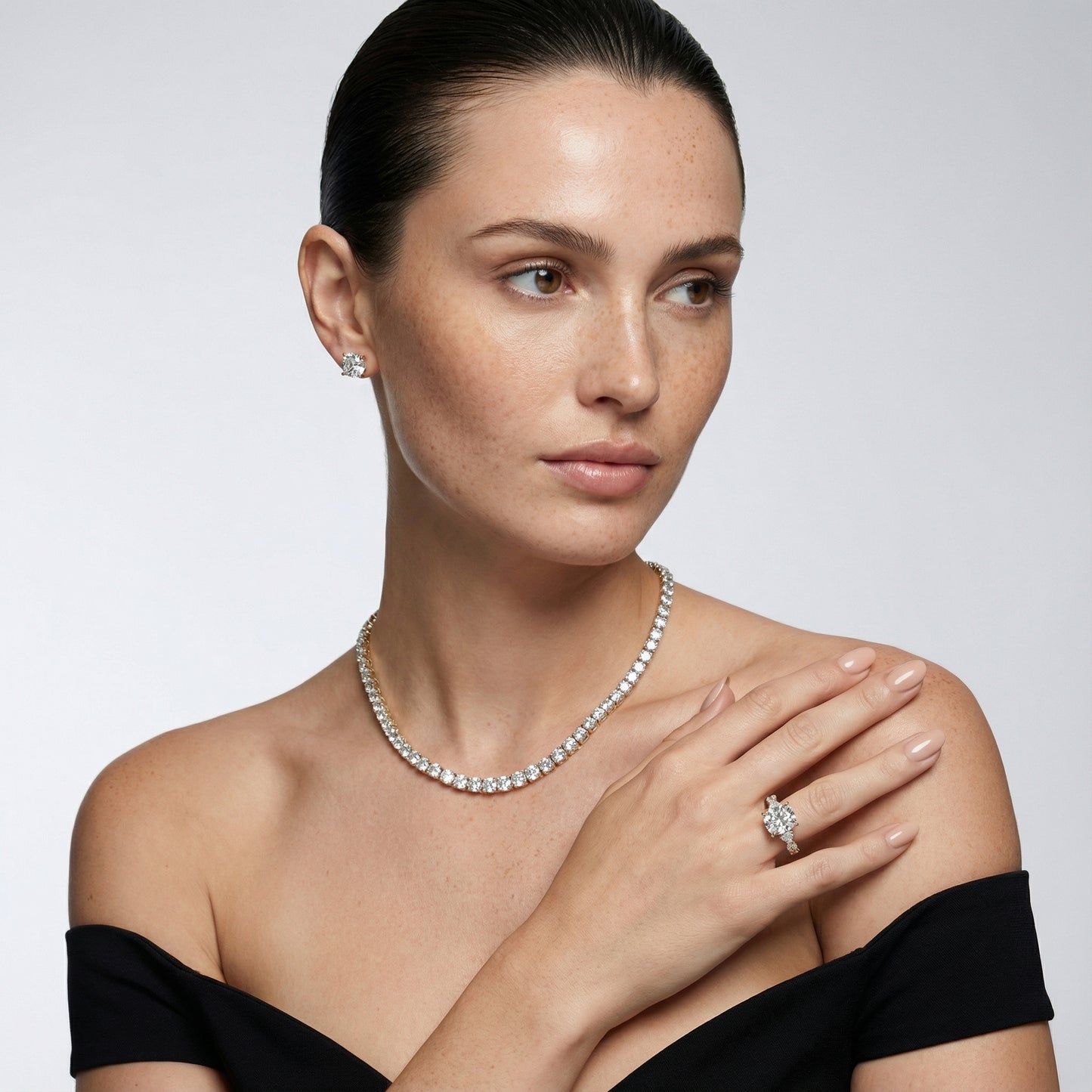 Cushion cut lab grown diamond engagement ring with marquise and pear side stones set in rich yellow gold.