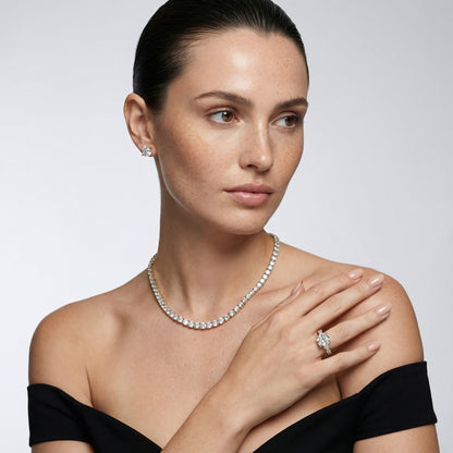 Cushion cut lab grown diamond engagement ring with marquise and pear side stones set in rich yellow gold.