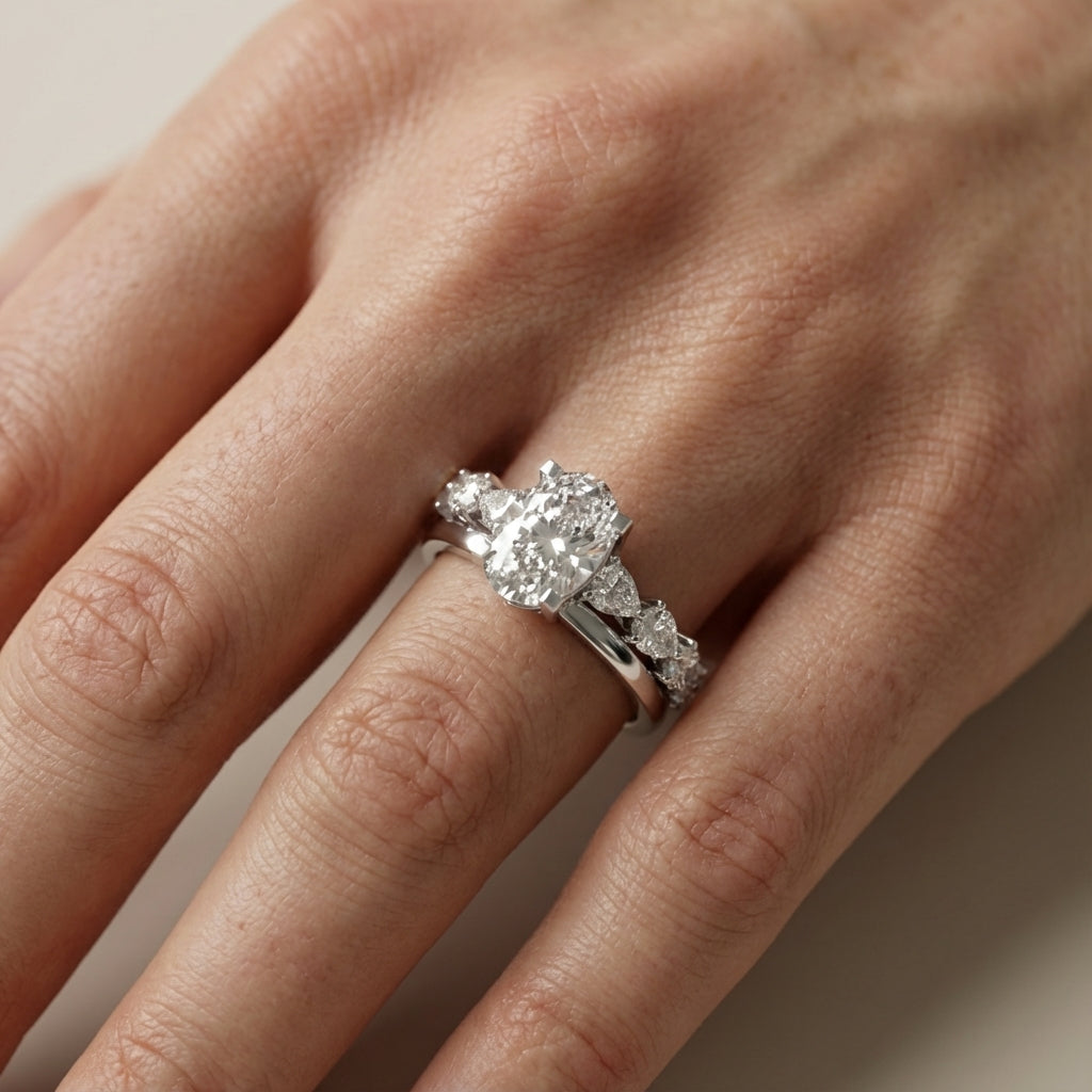 Oval Cut Lab Grown Diamond Engagement Ring with Marquise and Pear Side Stones in Platinum