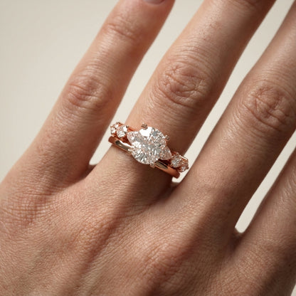 Cushion cut lab grown diamond engagement ring with marquise and pear side stones set in warm rose gold.