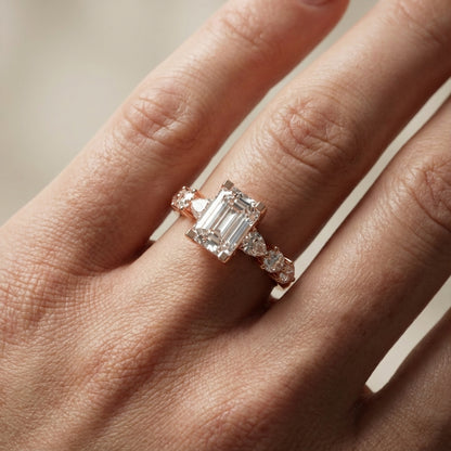 Emerald Cut Lab Grown Diamond Engagement Ring with Marquise and Pear Side Stones in Rose Gold