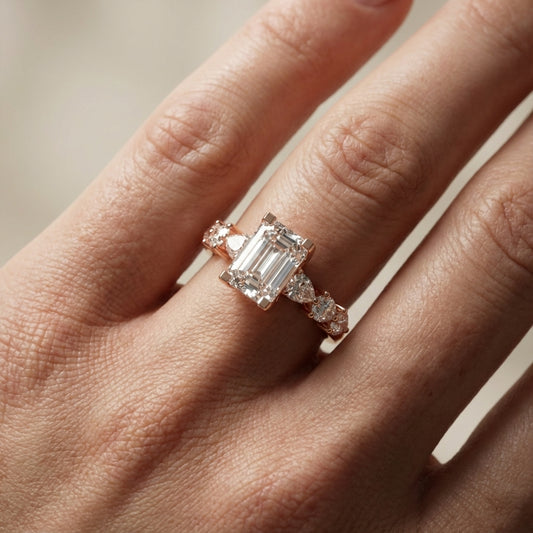 Emerald Cut Lab Grown Diamond Engagement Ring with Marquise and Pear Side Stones in Rose Gold