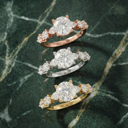 Cushion cut lab grown diamond engagement ring with marquise and pear side stones set in polished silver.