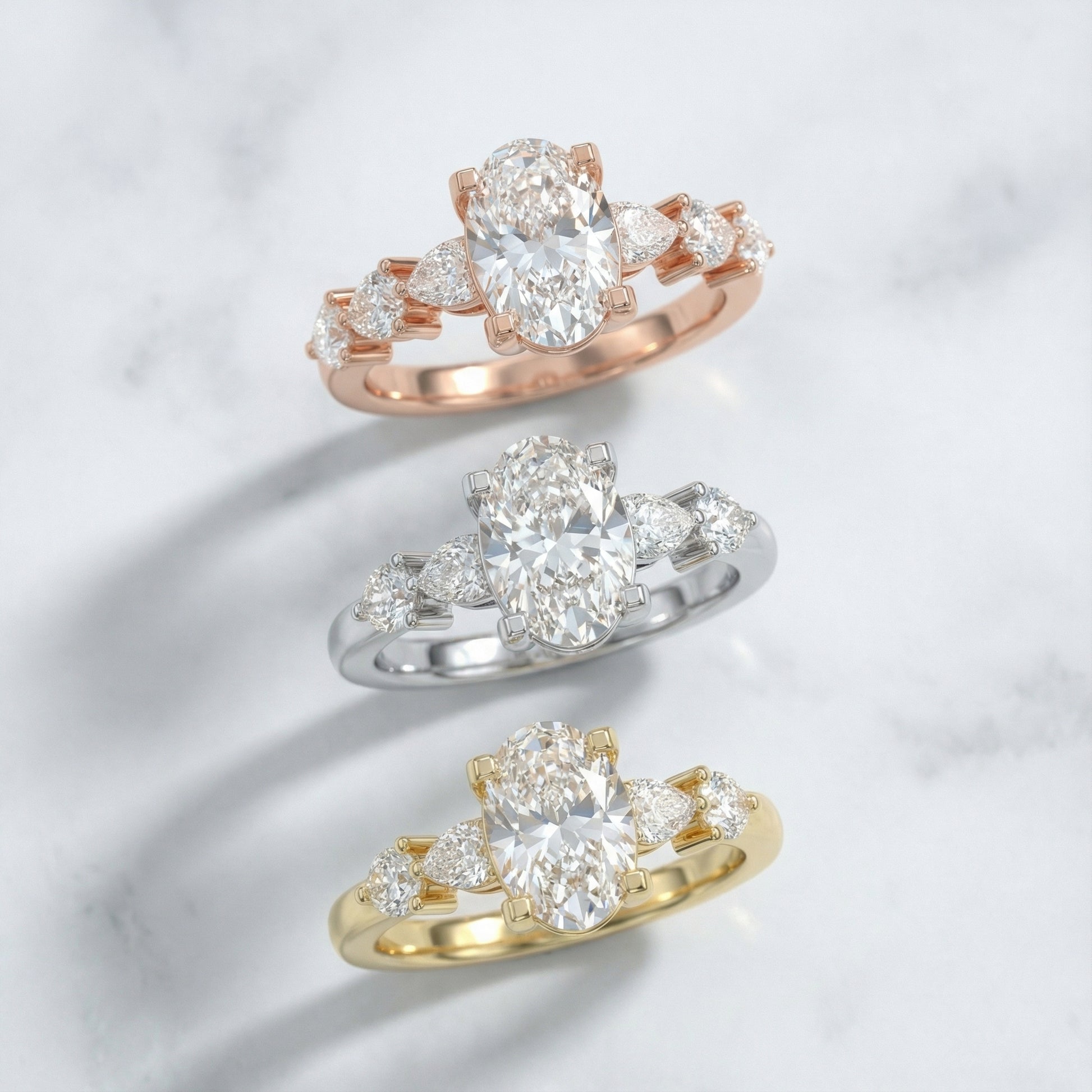 Oval Cut Lab Grown Diamond Engagement Ring with Marquise and Pear Side Stones in Rose Gold