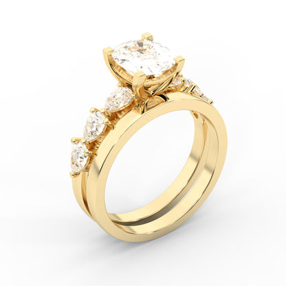 Cushion cut lab grown diamond engagement ring with marquise and pear side stones set in rich yellow gold.