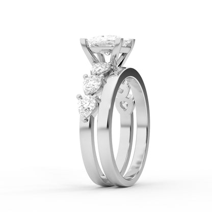 Cushion cut lab grown diamond engagement ring with marquise and pear side stones set in polished silver.