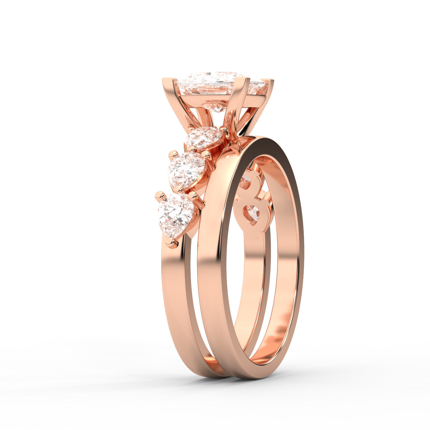Cushion cut lab grown diamond engagement ring with marquise and pear side stones set in warm rose gold.
