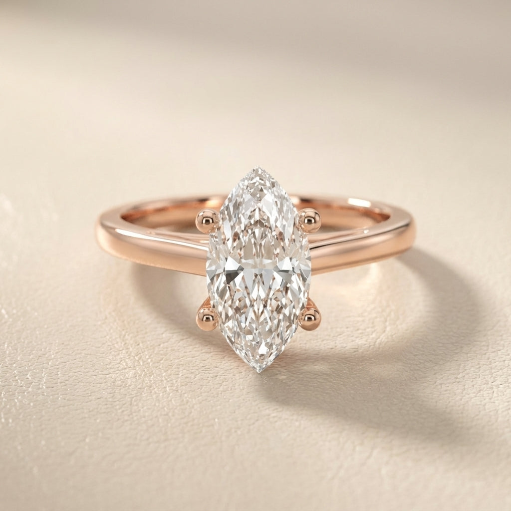 Rose Gold Marquise Cut Lab Grown Diamond Solitaire Engagement Ring with hidden scrollwork underneath.