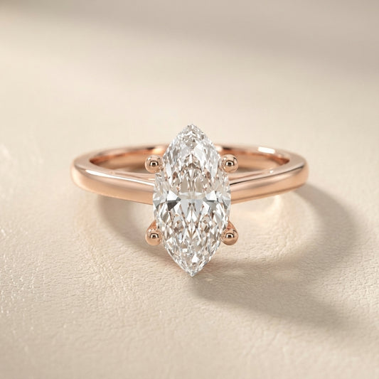 Rose Gold Marquise Cut Lab Grown Diamond Solitaire Engagement Ring with hidden scrollwork underneath.