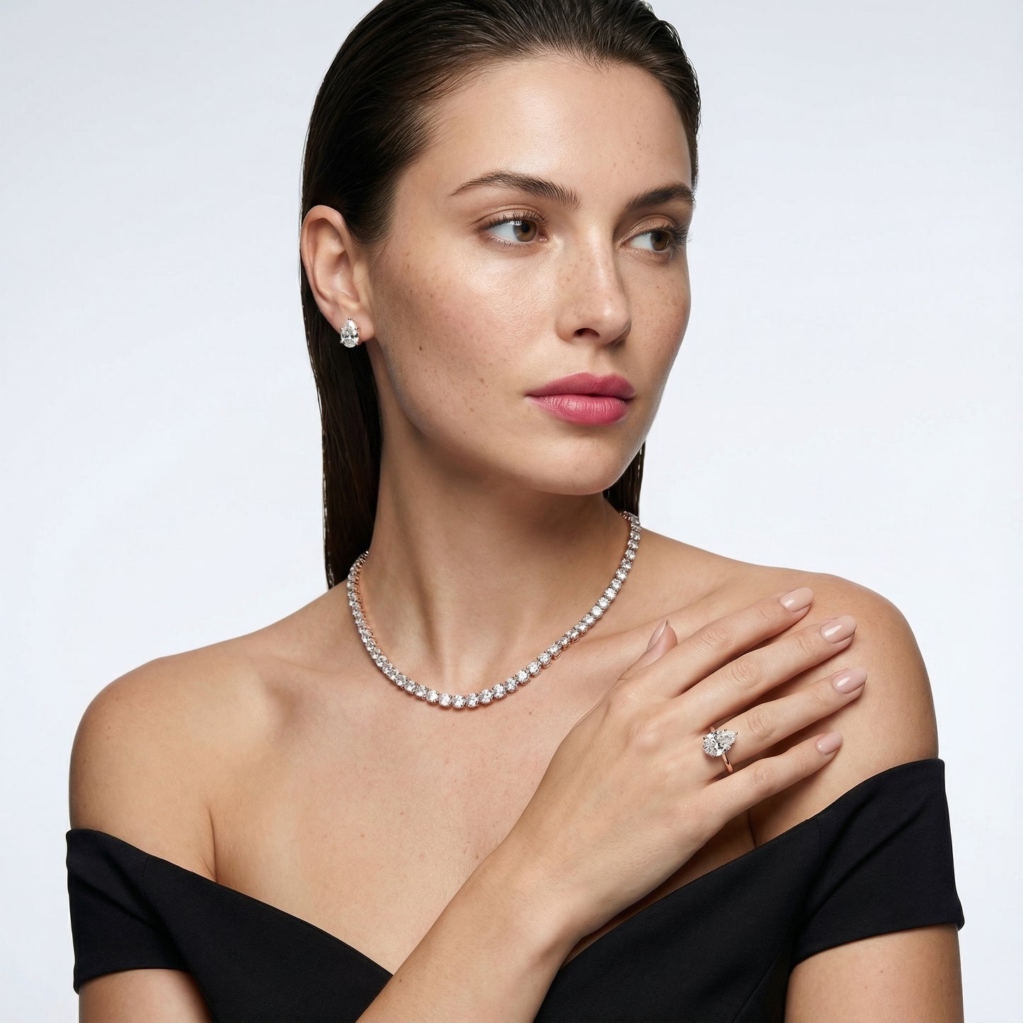 Pear Cut Lab Grown Diamond Solitaire Engagement Ring in Rose Gold showing side profile scrollwork