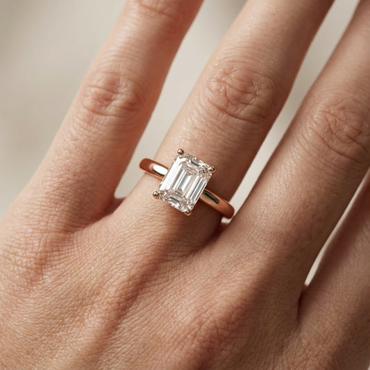 Emerald Cut Lab Grown Diamond Solitaire Engagement Ring in Rose Gold showing side profile with hidden detail