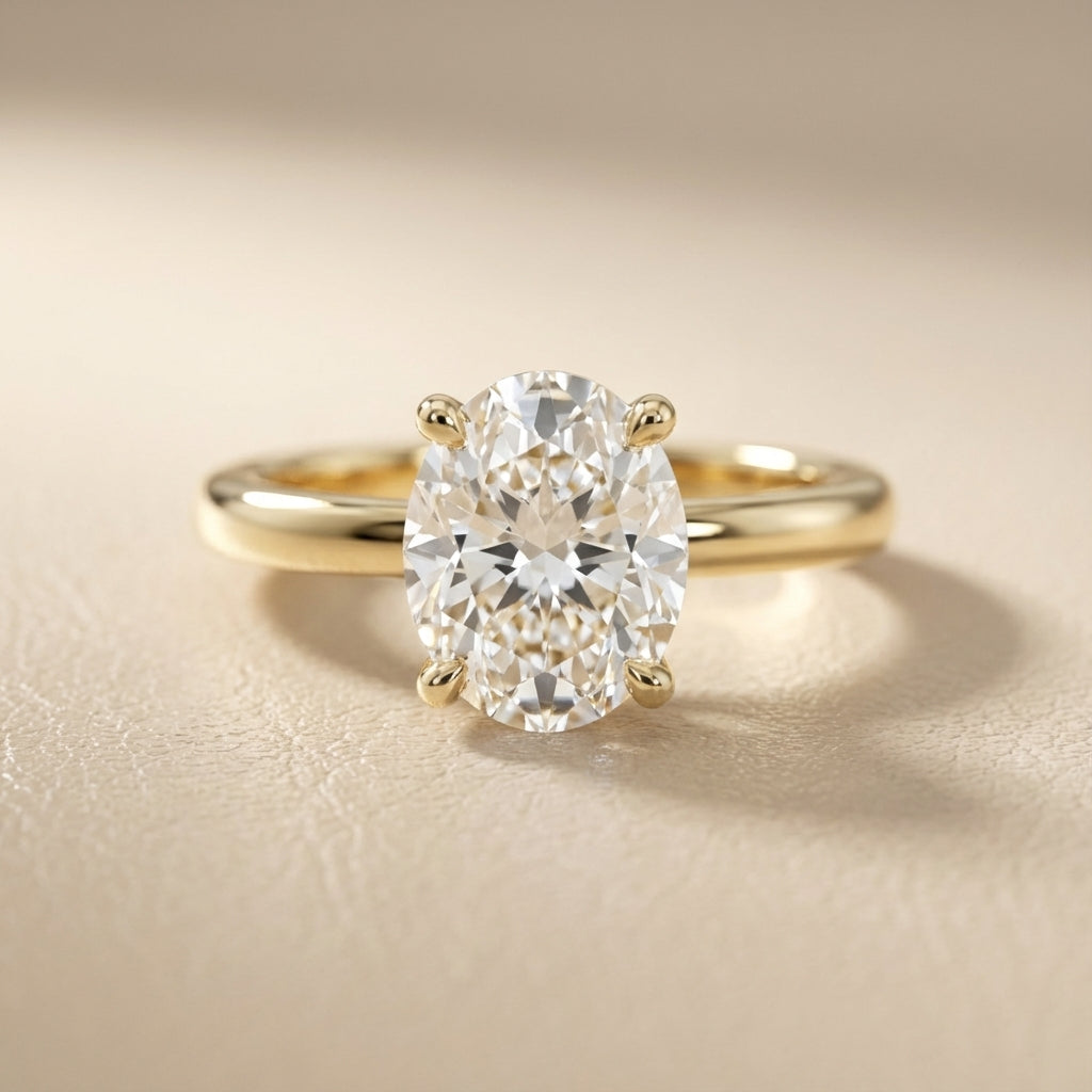 Oval Cut Lab Grown Diamond Engagement Ring in Yellow Gold with chevron under-bezel detail