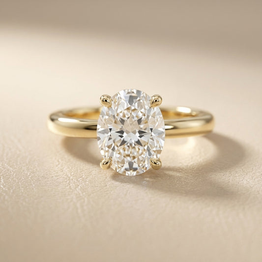 Oval Cut Lab Grown Diamond Engagement Ring in Yellow Gold with chevron under-bezel detail