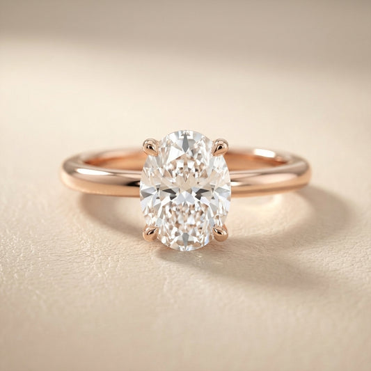 Oval Cut Lab Grown Diamond Engagement Ring in Rose Gold with chevron under-bezel detail