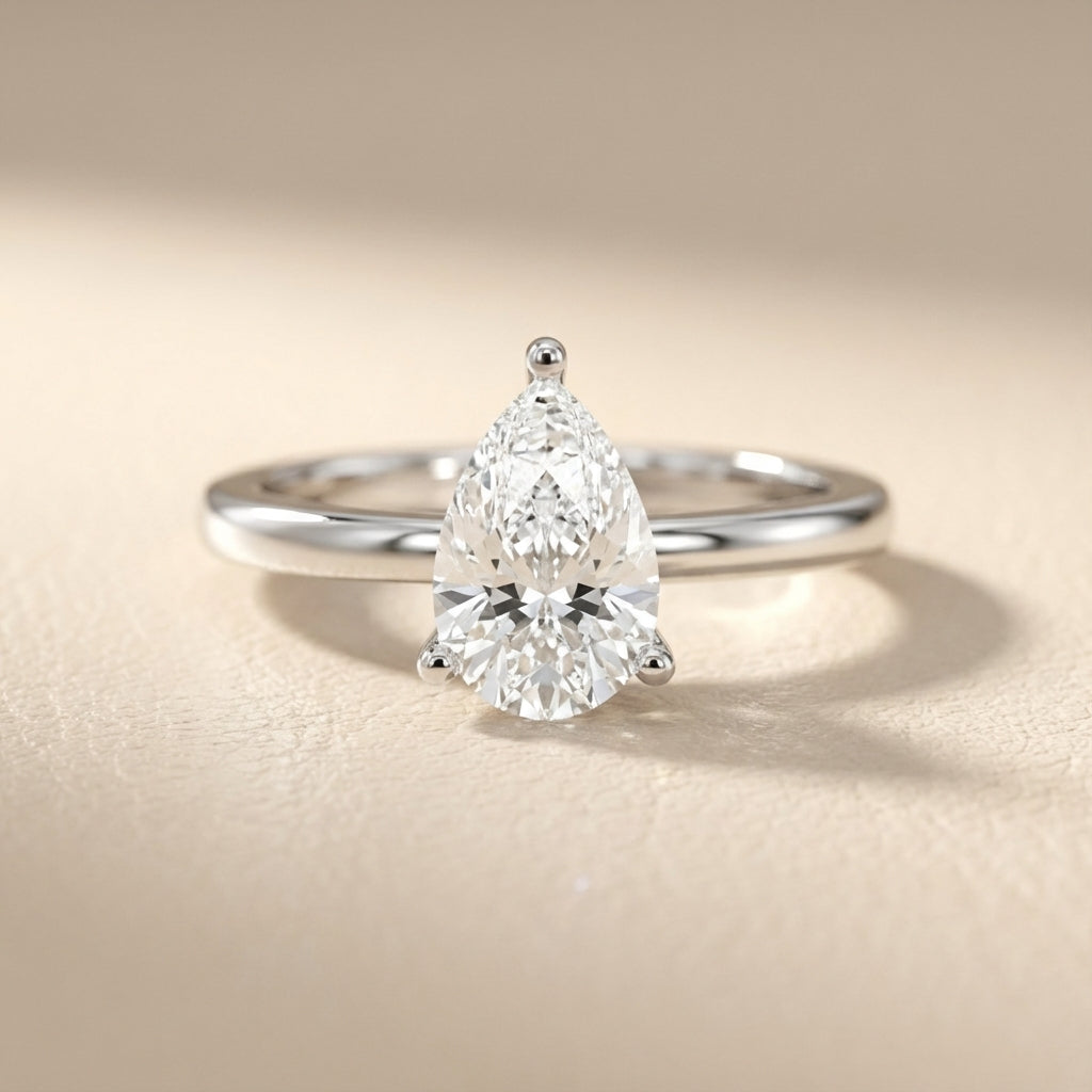 Pear Cut Lab Grown Diamond Solitaire Engagement Ring in Silver showing chevron detail beneath the stone.