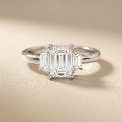 Emerald Cut Lab Grown Diamond Solitaire Engagement Ring in Polished Silver claw setting.