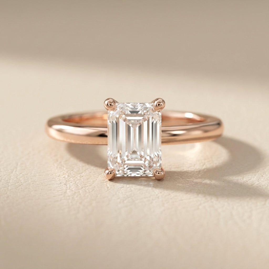 Emerald Cut Lab Grown Diamond Solitaire Engagement Ring in warm Rose Gold setting.