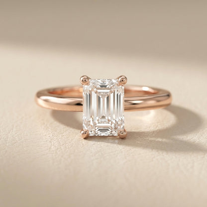 Emerald Cut Lab Grown Diamond Solitaire Engagement Ring in warm Rose Gold setting.