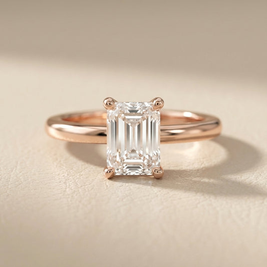 Emerald Cut Lab Grown Diamond Solitaire Engagement Ring in warm Rose Gold setting.