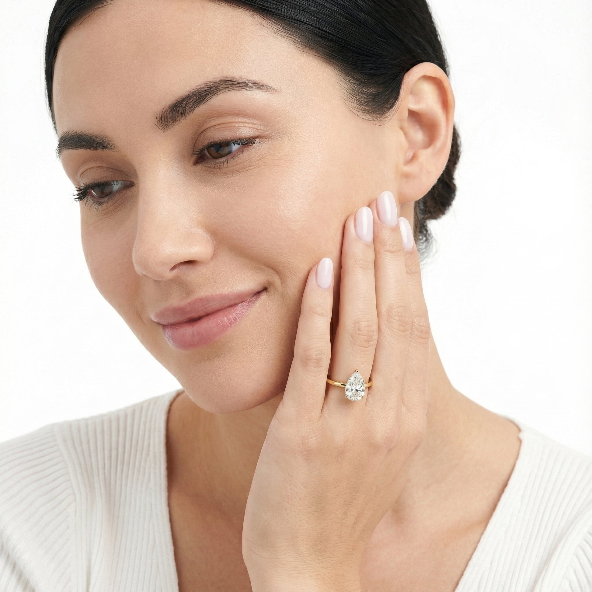 Pear Cut Lab Grown Diamond Solitaire Engagement Ring in Yellow Gold showing traditional band and modern setting.