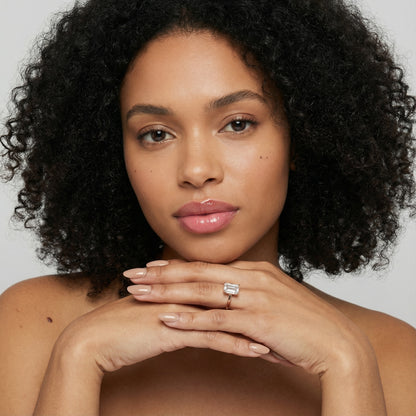 Emerald Cut Lab Grown Diamond Solitaire Engagement Ring in warm Rose Gold setting.