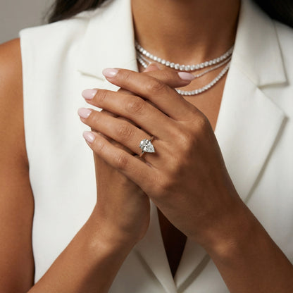 Side view of Pear Cut Lab Grown Diamond Solitaire Engagement Ring in White Gold highlighting chevron setting.