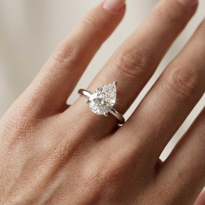 Pear Cut Lab Grown Diamond Solitaire Engagement Ring in Silver showing chevron detail beneath the stone.