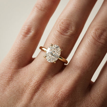 Oval Cut Lab Grown Diamond Engagement Ring in Yellow Gold with chevron under-bezel detail