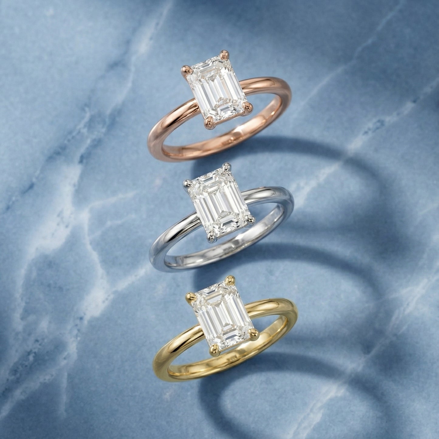 Emerald Cut Lab Grown Diamond Solitaire Engagement Ring in warm Rose Gold setting.