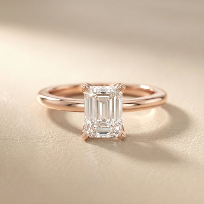Emerald Cut Lab Grown Diamond Solitaire Engagement Ring in Rose Gold showing side profile and bridge