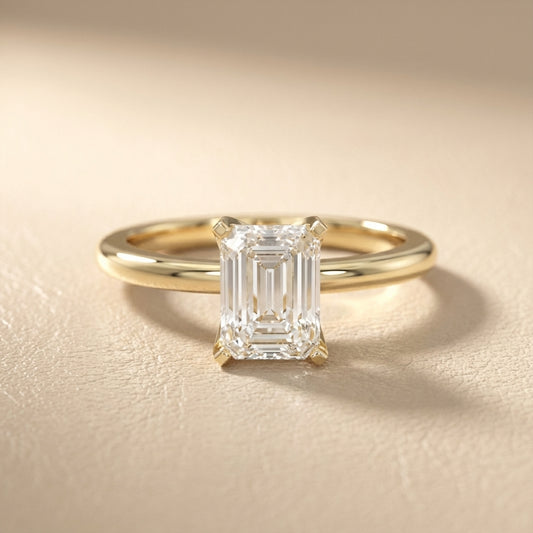 Emerald Cut Lab Grown Diamond Solitaire Engagement Ring in Yellow Gold showing cathedral setting