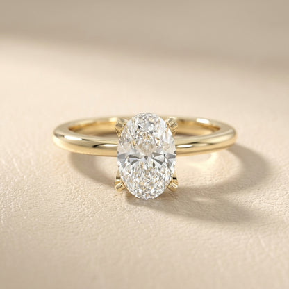 Oval Cut Lab Grown Diamond Engagement Ring in Yellow Gold with unique bridge profile