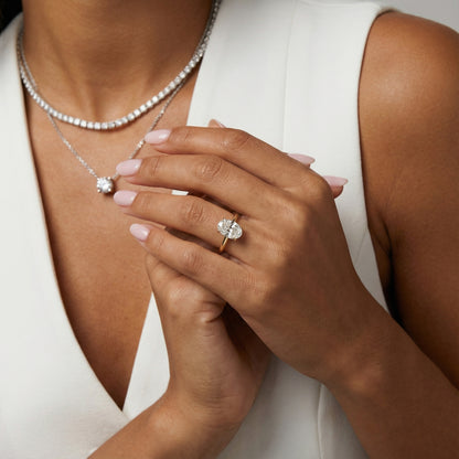 Oval Cut Lab Grown Diamond Engagement Ring in Yellow Gold with unique bridge profile