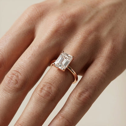 Emerald Cut Lab Grown Diamond Solitaire Engagement Ring in Rose Gold showing side profile and bridge