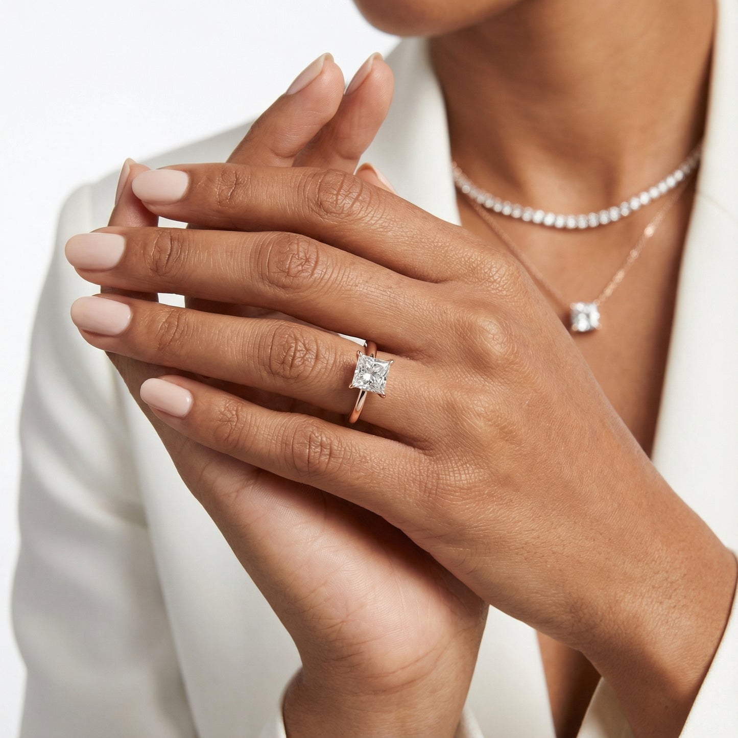 Princess Cut Lab Grown Diamond Solitaire Engagement Ring in Rose Gold showing side profile and unique setting.