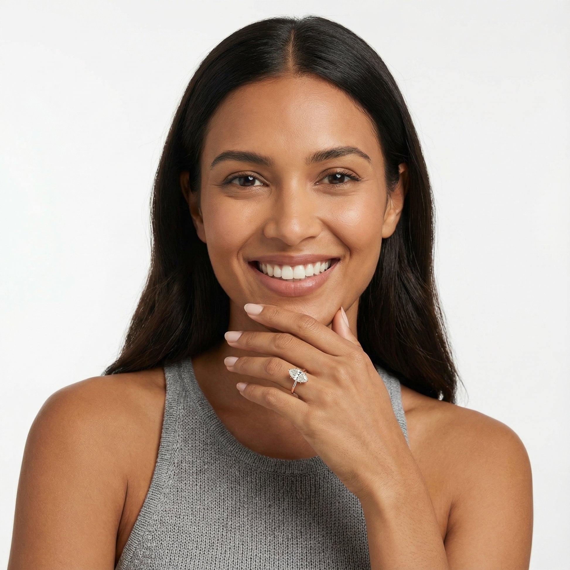 Marquise cut lab grown diamond solitaire engagement ring in rose gold showing cathedral setting and floral prongs.