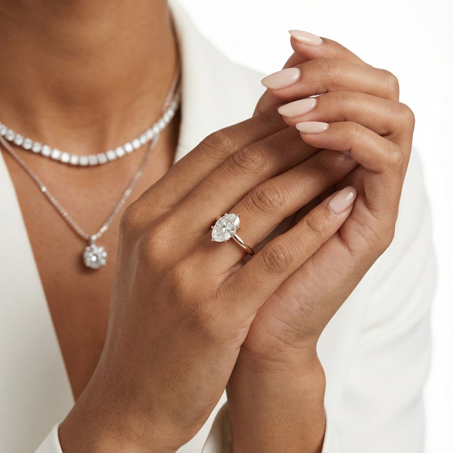 Oval Cut Lab Grown Diamond Solitaire Engagement Ring in Rose Gold showing floral prong details.