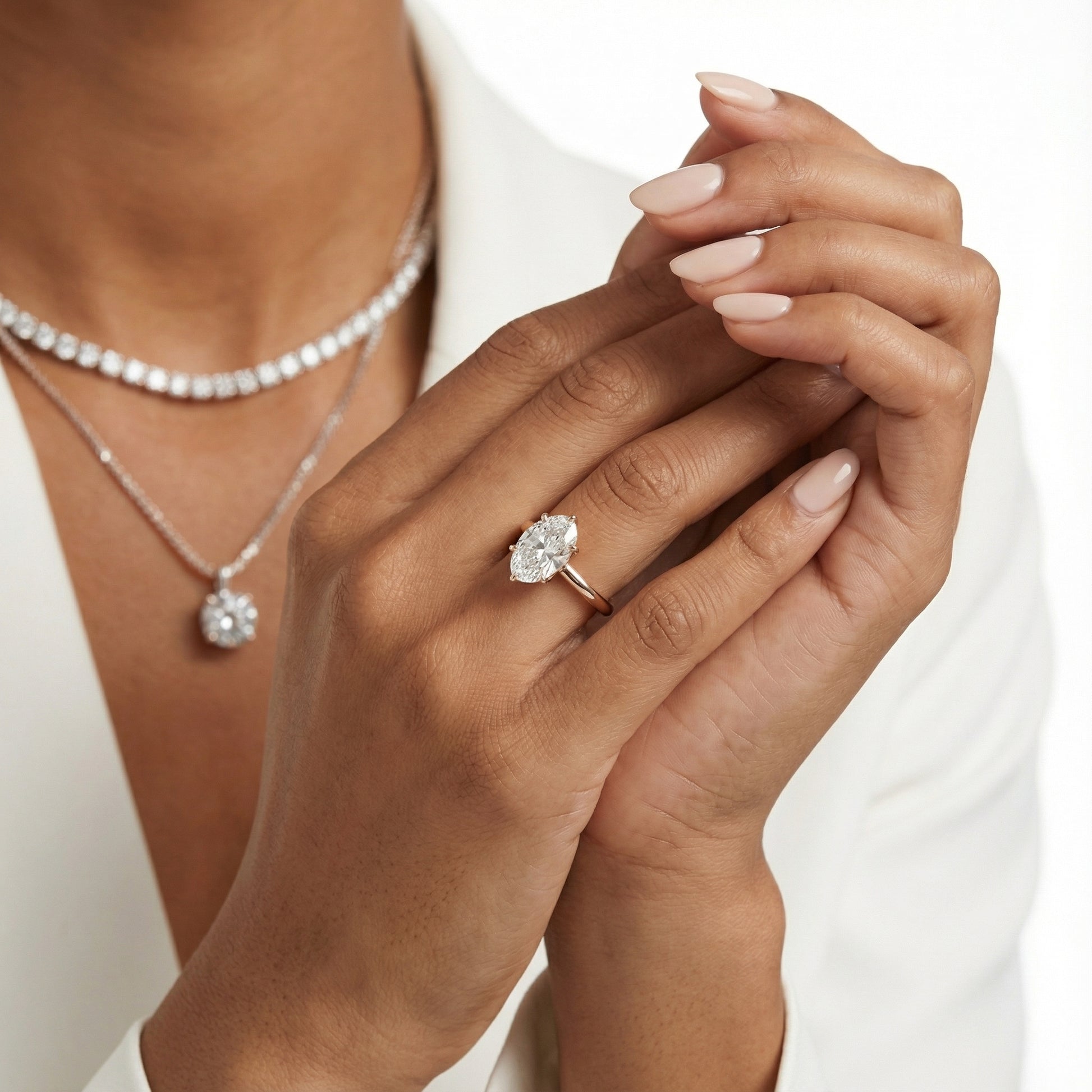 Oval Cut Lab Grown Diamond Solitaire Engagement Ring in Rose Gold showing floral prong details.