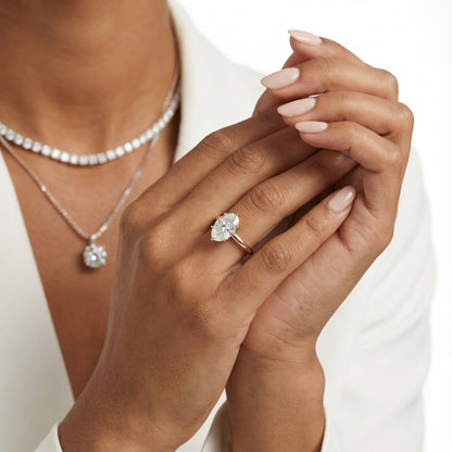 Oval Cut Lab Grown Diamond Solitaire Engagement Ring in Rose Gold showing floral prong details.