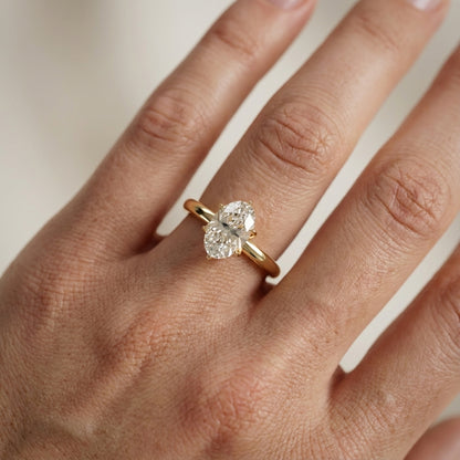 Oval Cut Lab Grown Diamond Solitaire Engagement Ring in Yellow Gold with six prong setting.
