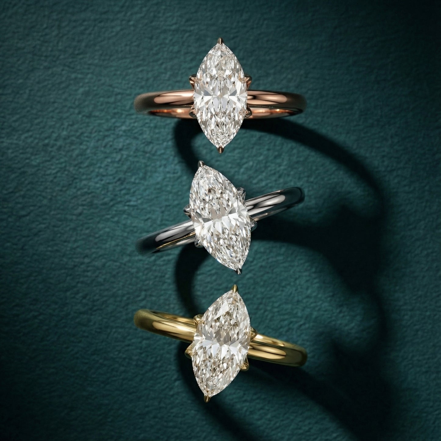 Platinum marquise cut lab grown diamond solitaire engagement ring exhibiting high polish and floral prong details.